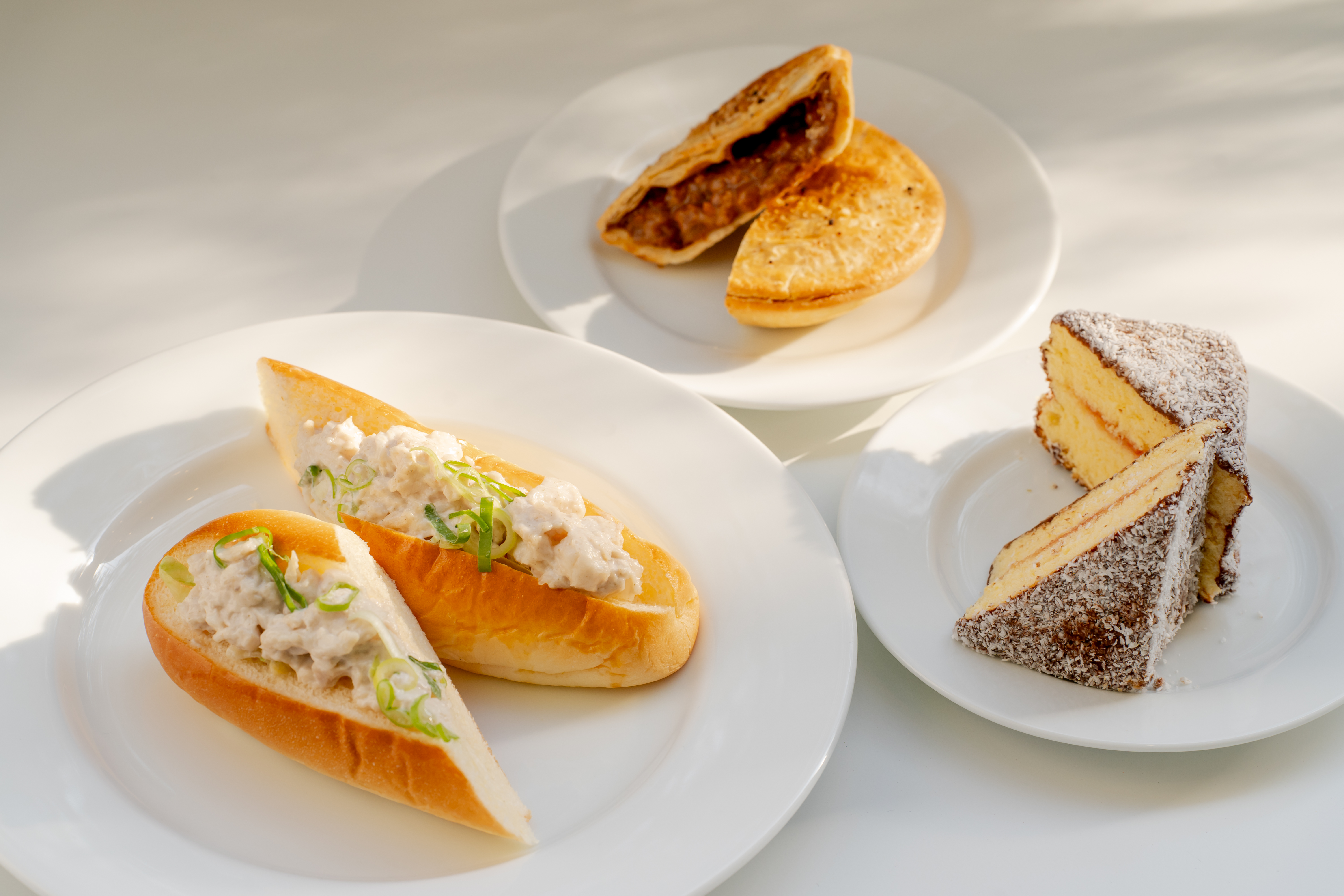 A crocodile brioche roll, meat pie and lamington