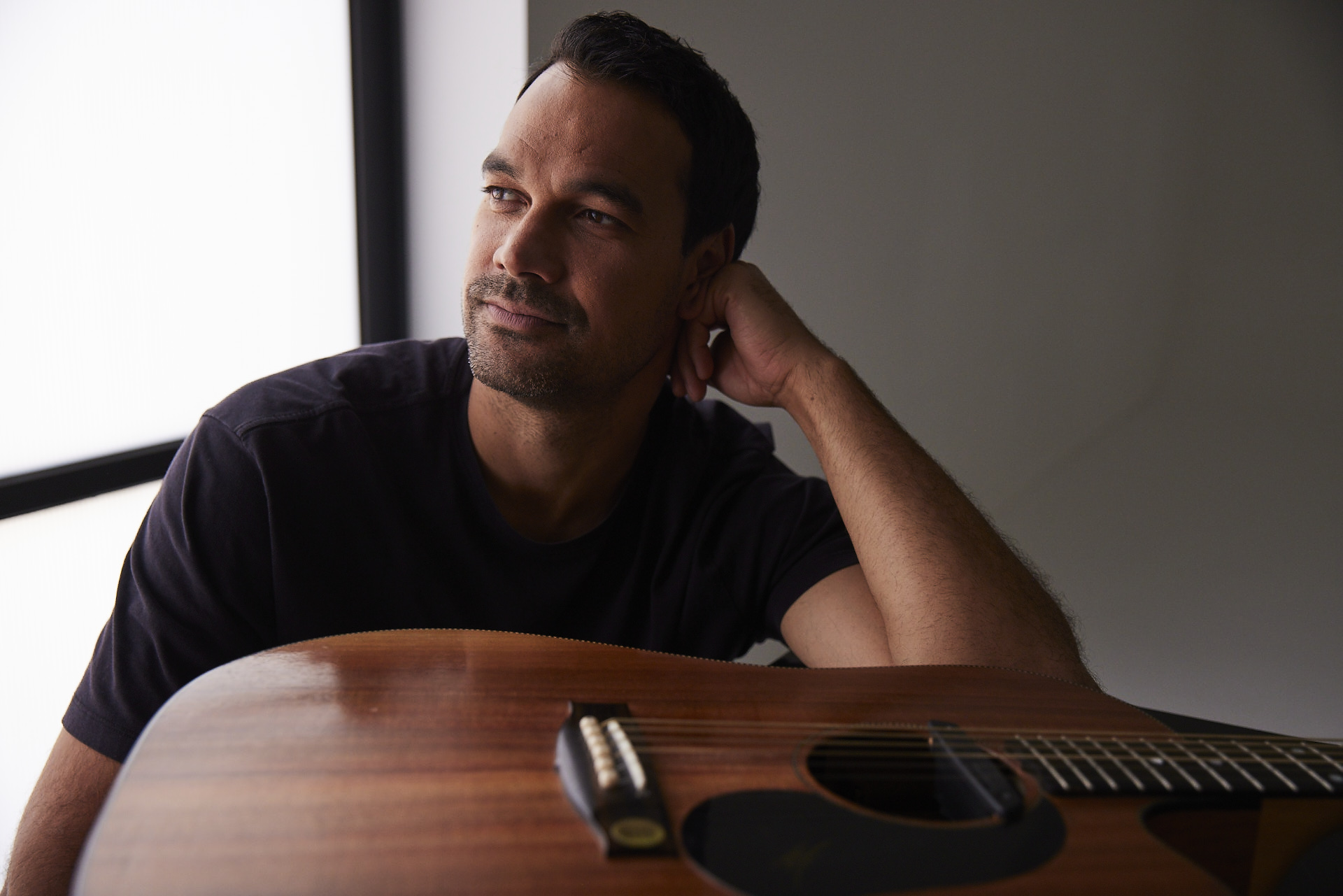 Joel Havea photographed with a guitar