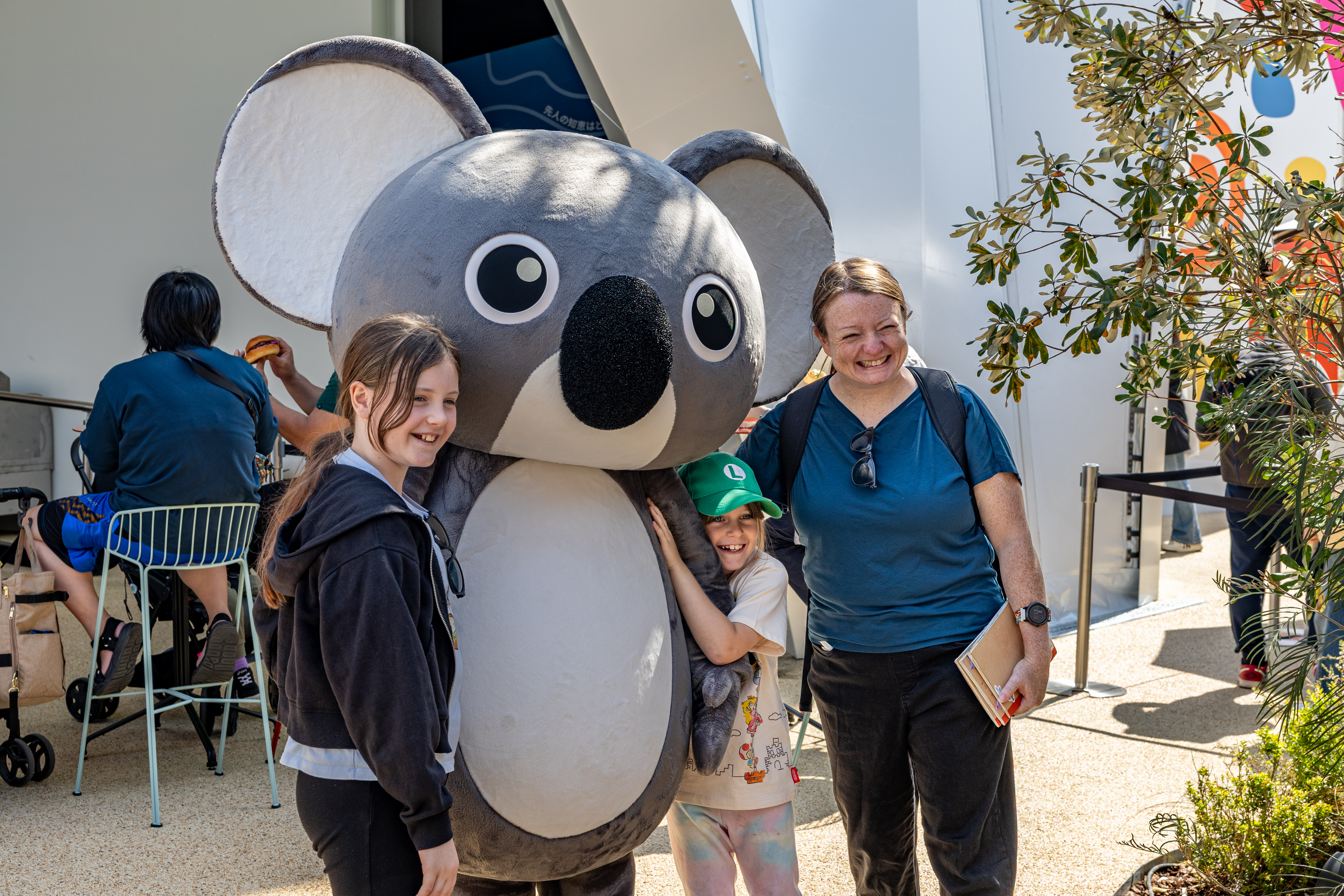Koko the Koala with visitors at the Australia Pavilion